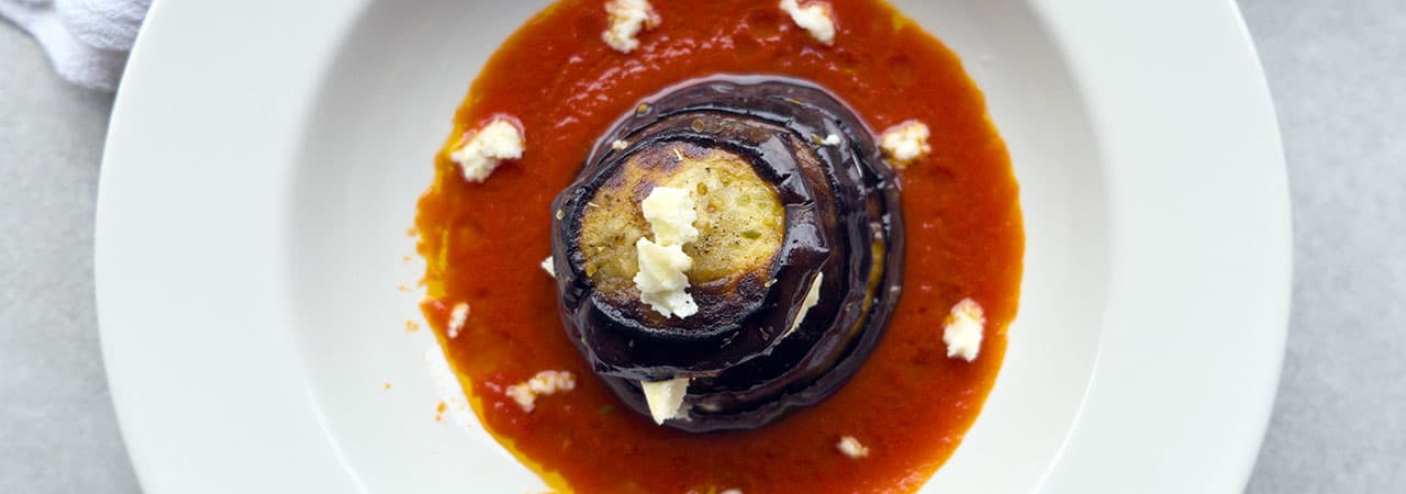 Eggplant millefeuille with mozzarella and tomato sauce
